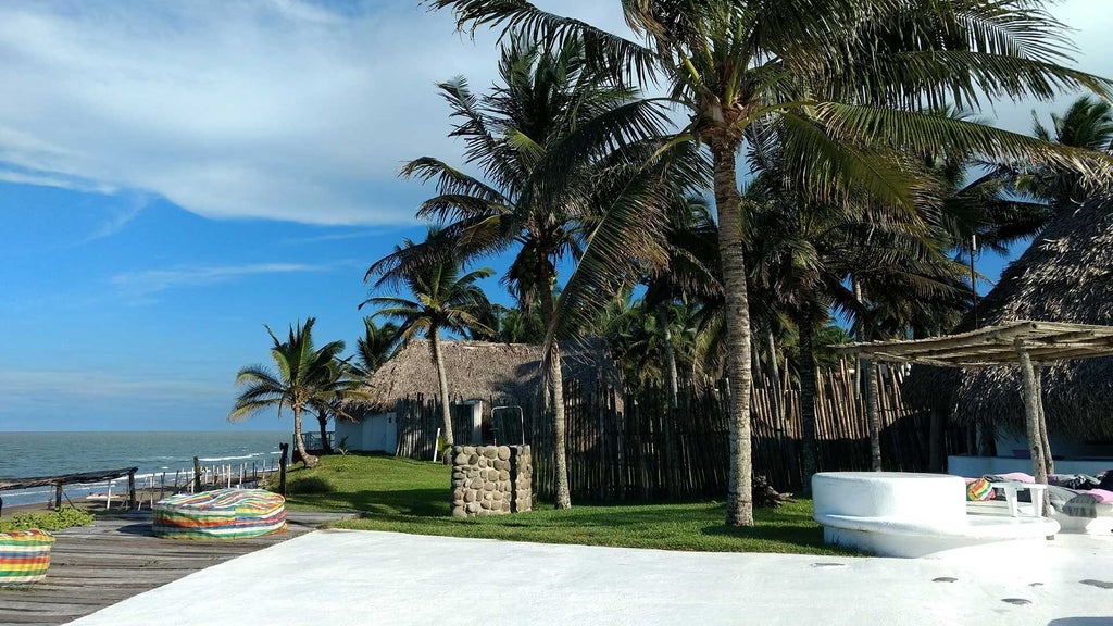 Luxurious white-washed boutique hotel with panoramic ocean views, nestled on a cliff overlooking the scenic coastline of a Mexican tropical destination