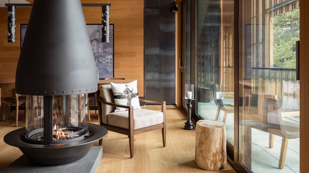 Elegant alpine-inspired luxury suite with minimalist design, floor-to-ceiling windows revealing Swiss mountain panorama, warm wood tones and contemporary furniture