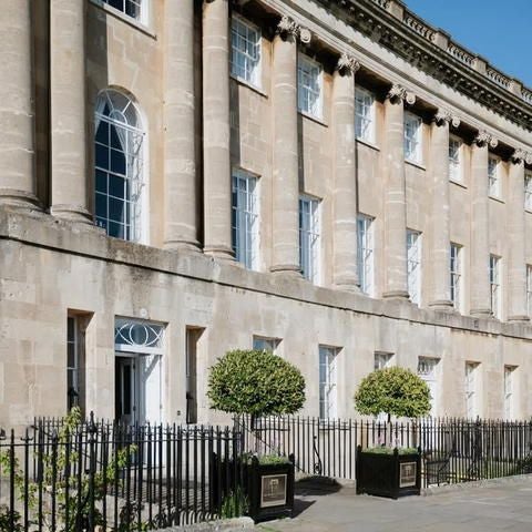 Elegant Georgian-style family suite at scenset Royal Crescent Hotel & Spa, featuring plush bedding, antique furnishings, and refined architectural details