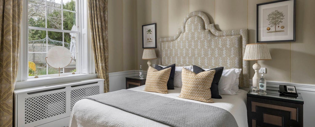 Elegant junior suite at scenset Royal Crescent Hotel & Spa, featuring plush bedding, classic British decor, and soft natural lighting with refined architectural details