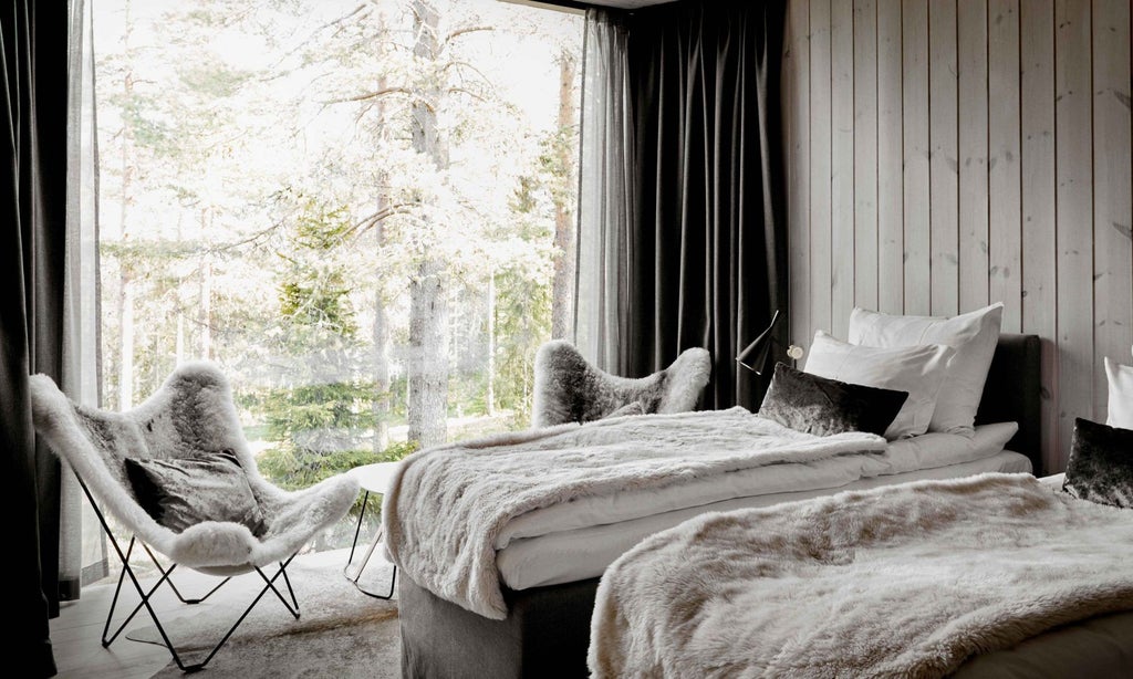 Luxurious wooden suite with panoramic windows overlooking snowy Finnish forest, modern Nordic design, cozy fireplace, and minimalist elegant furnishings