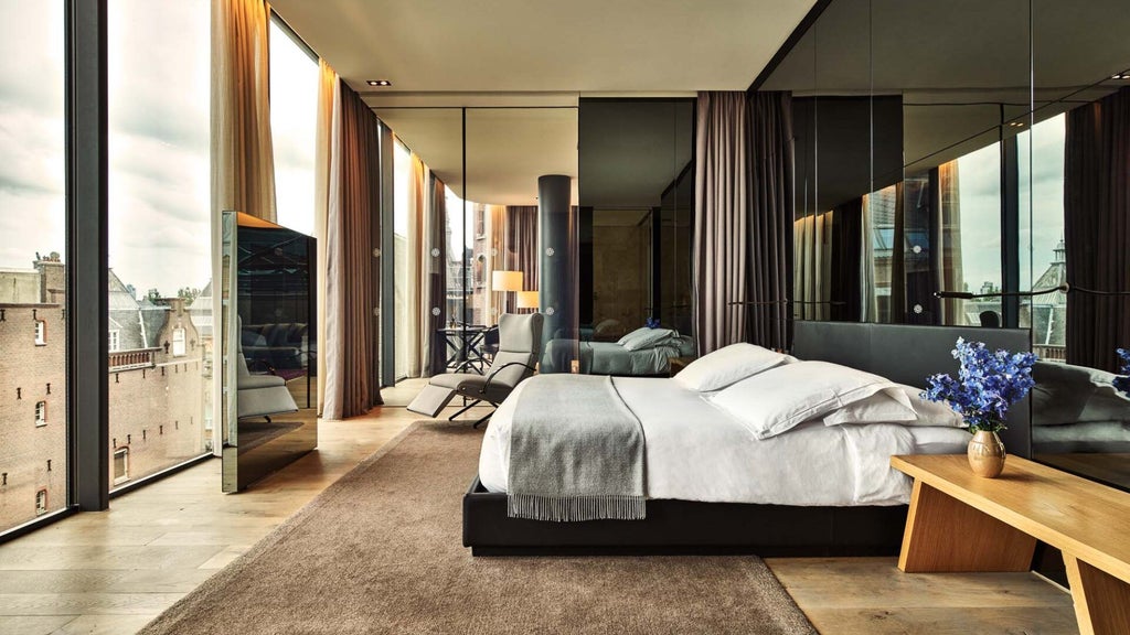 Luxurious penthouse suite at Conservatorium Hotel, Amsterdam, featuring elegant modern design with expansive windows and sophisticated minimalist decor