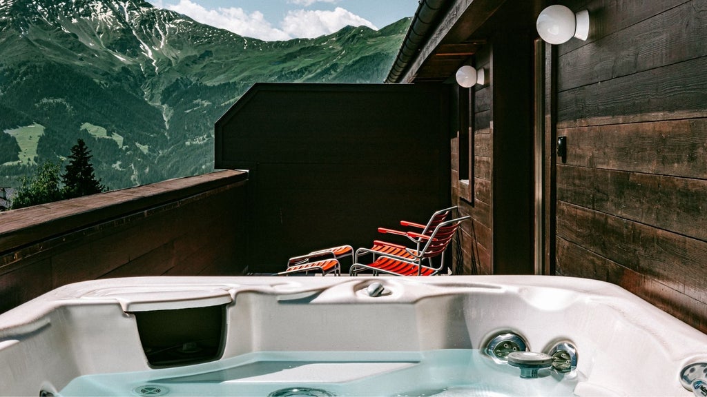 Luxurious Swiss mountain chalet suite with panoramic alpine views, modern minimalist design, floor-to-ceiling windows, and elegant wood-paneled interior