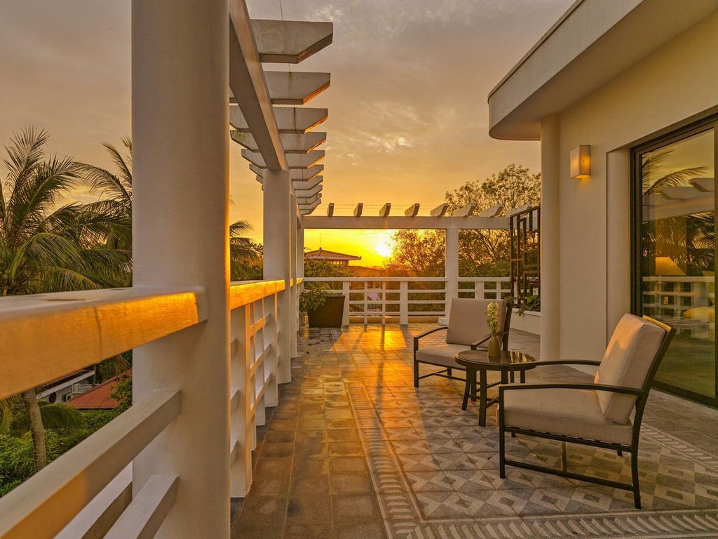 Elegant Perfume River Suite with colonial-style decor, plush king bed, and panoramic river views at Azerai La Residence in historic Hue, Vietnam