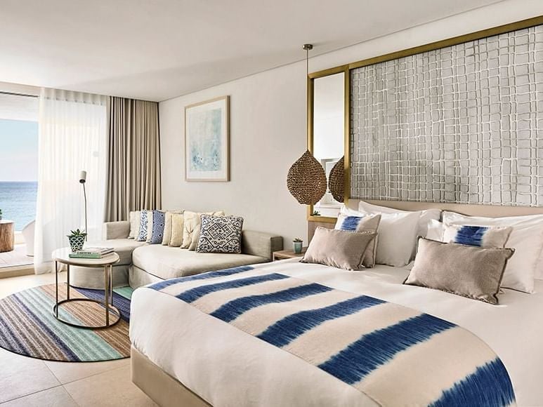 Luxurious junior suite at Nobu Hotel Ibiza Bay with private plunge pool, crisp white decor, and stunning ocean-inspired design in coastal Spain