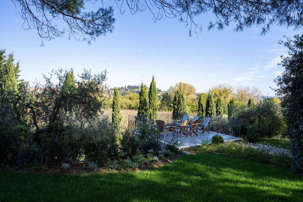 Luxurious tuscan villa with terracotta walls and stone archways surrounded by manicured gardens, overlooking rolling countryside hills