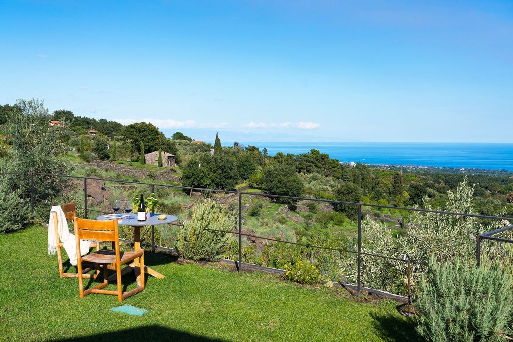 Luxurious two-bedroom pool villa at Monaci delle Terre Nere, featuring elegant Sicilian design with panoramic countryside views and modern amenities.