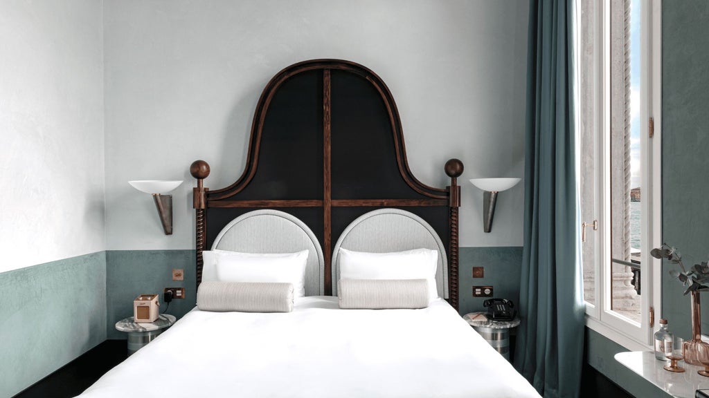 Luxurious Venetian hotel room with expansive canal view, elegant Italian decor, plush king bed, and soft neutral color palette with ornate architectural details