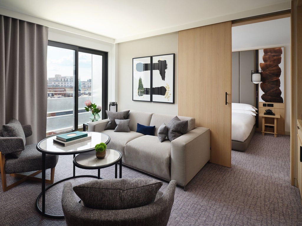 Luxurious zen suite at Nobu Hotel in London, featuring minimalist design, soft neutral tones, modern furnishings, and a tranquil, sophisticated atmosphere