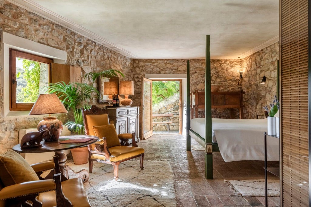 Elegant stone-walled Tuscan suite with arched windows, rustic wooden furniture, and plush white linens overlooking scenic Italian countryside landscape