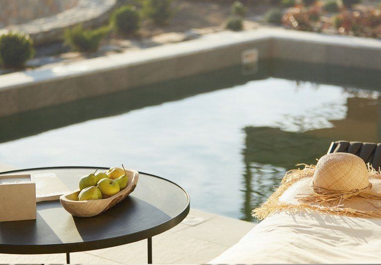 Luxurious junior suite with private pool overlooking azure Aegean waters, featuring modern design and elegant white furnishings at ELIVI Skiathos resort