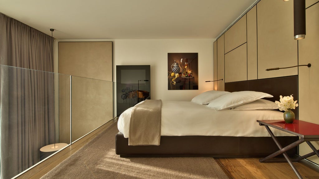 Luxurious grand junior suite with modern design, featuring elegant neutral tones, sleek furniture, expansive windows overlooking urban scenset landscape