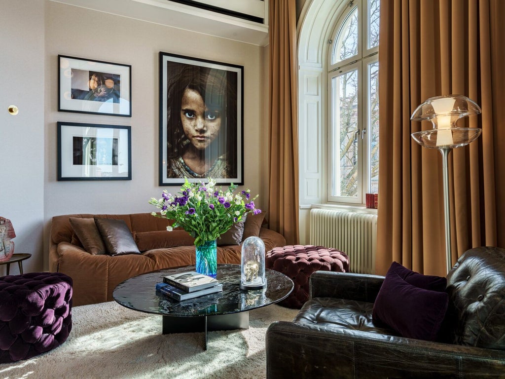 Elegant large king room at Lydmar Hotel, featuring plush white bedding, minimalist Scandinavian design, and soft natural lighting from expansive windows