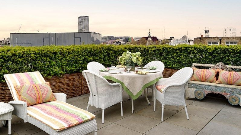 Luxurious modern hotel room with contemporary furnishings, soft neutral tones, floor-to-ceiling windows, and elegant minimalist design at Ham Yard Residences