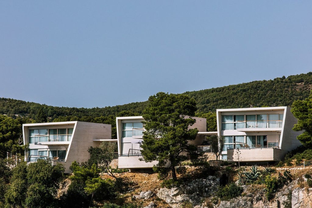 Luxurious seaside resort with modern architecture, white buildings, and blue Adriatic Sea backdrop in Šibenik, Croatia, overlooking pristine coastline