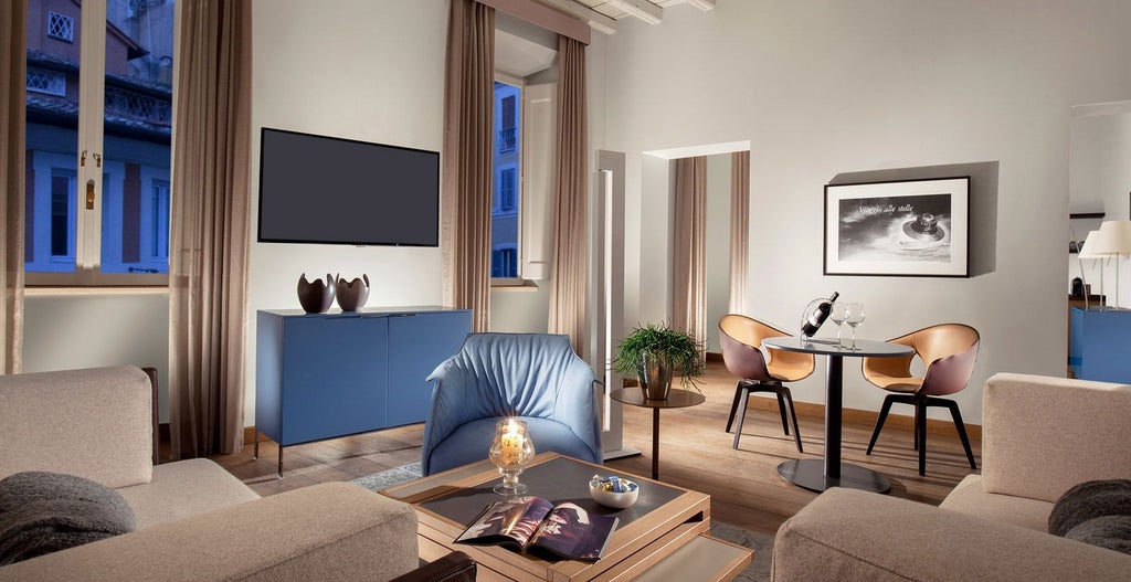 Elegant deluxe hotel room at Palazzo Scanderbeg in Italy, featuring luxurious white linens, rich wood furnishings, and soft ambient lighting