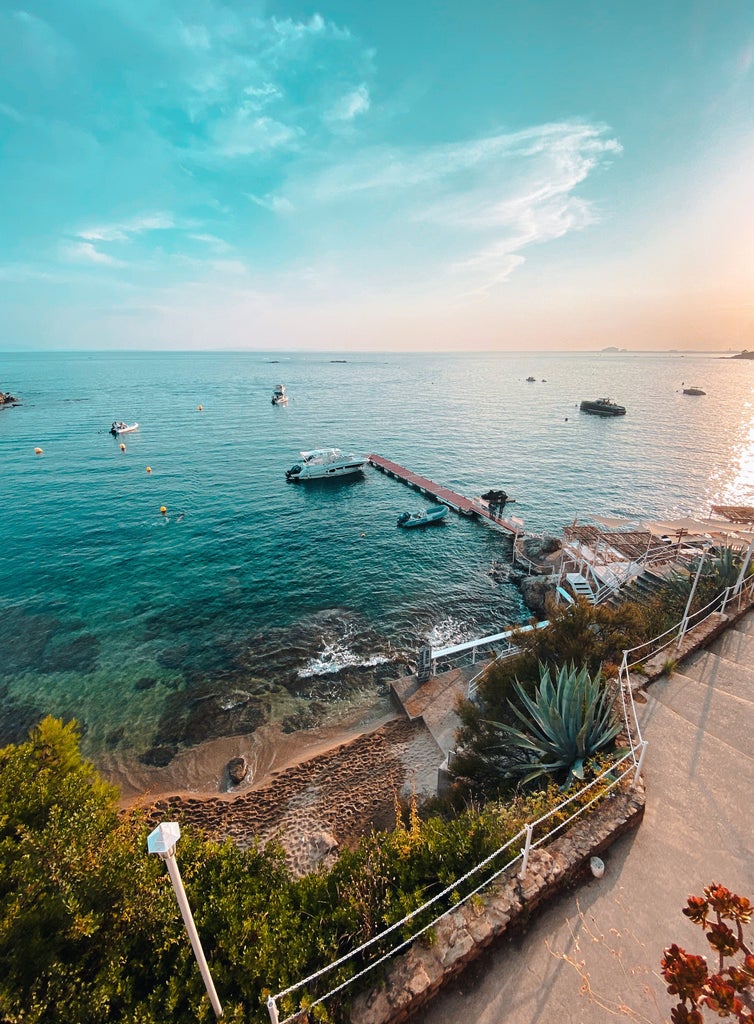 Elegant beachfront Hotel Vistabella in Spain with white Mediterranean architecture, panoramic sea views, and a luxurious infinity pool