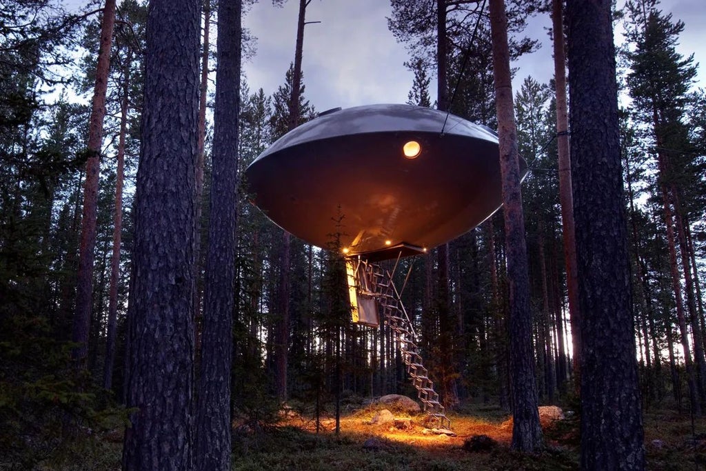 Suspended UFO-shaped hotel room with sleek metallic exterior, hovering among pine trees in a lush Swedish forest landscape at twilight