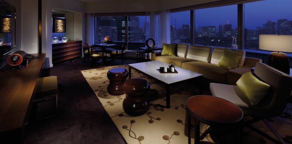 Elegant Park Suite at Tokyo's luxury hotel, featuring contemporary design with panoramic city views, minimalist furniture, and floor-to-ceiling windows overlooking urban landscape.