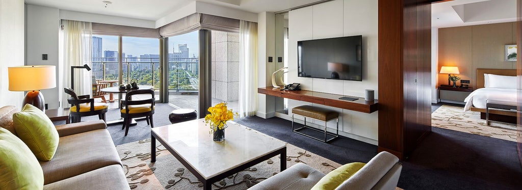 Spacious executive suite with panoramic Tokyo skyline, contemporary Japanese design, plush king bed, and elegant minimalist furnishings in soft neutral tones