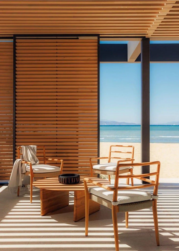 Luxurious two-bedroom seafront suite with minimalist design, white marble surfaces, and panoramic Aegean Sea view at scenset resort in Greece