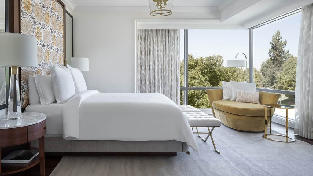 Luxurious Malibu Corner One-Bedroom Suite at Four Seasons Westlake Village, featuring elegant decor, plush king bed, and expansive city and mountain views