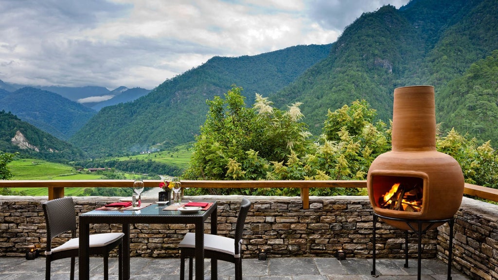 Elegant one-bedroom villa with sweeping Himalayan mountain views, rustic wooden furnishings, and traditional Bhutanese architectural design in warm, natural tones