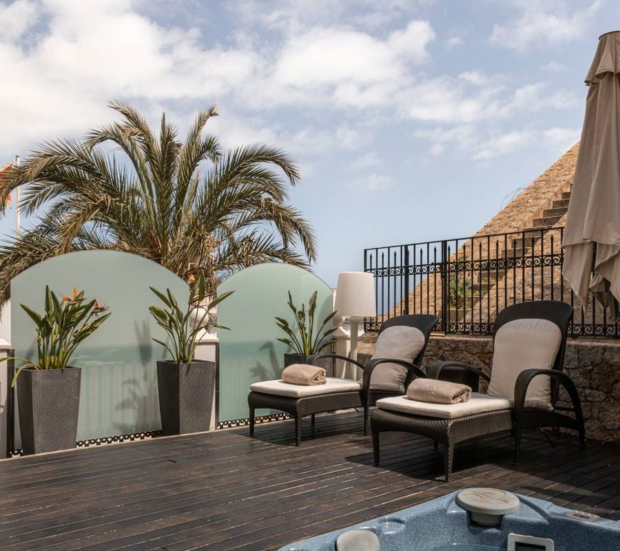 Luxurious historic hotel nestled on Dalt Vila's hilltop, showcasing stunning Ibiza Old Town views with elegant Mediterranean architecture and terracotta rooftops