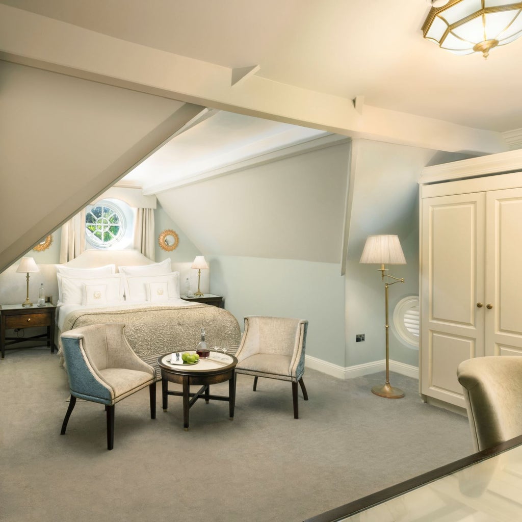 Luxurious cosy hotel room at Grantley Hall with plush bedding, elegant furnishings, warm neutral tones, and sophisticated contemporary design in the United Kingdom.