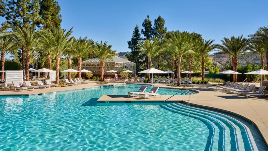 Luxurious Four Seasons Hotel Westlake Village nestled amid California landscapes, featuring modern architecture, pristine grounds, and elegant swimming pool