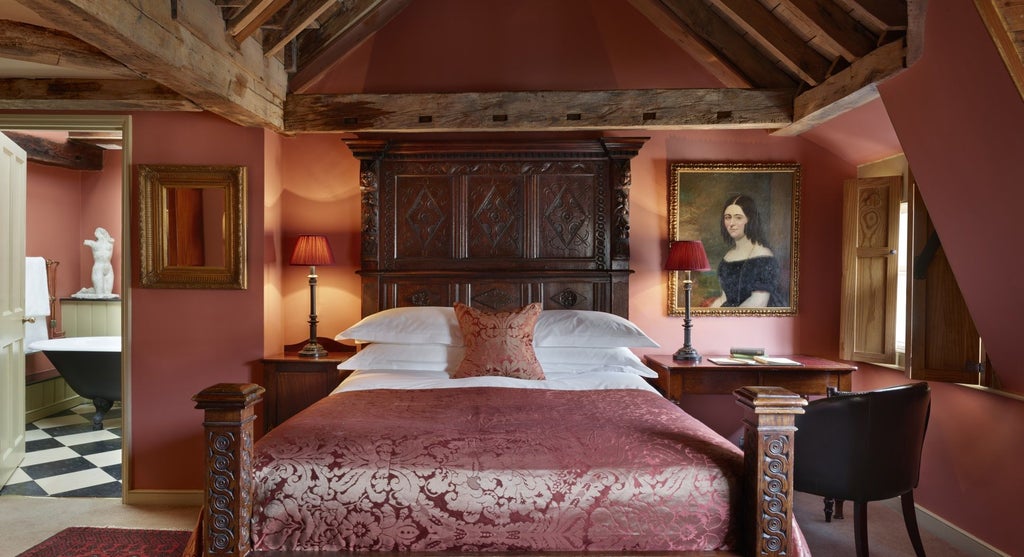 Elegant Georgian-style boutique hotel exterior with warm brick facade, ornate windows, and classic architectural details in a historic UK setting.