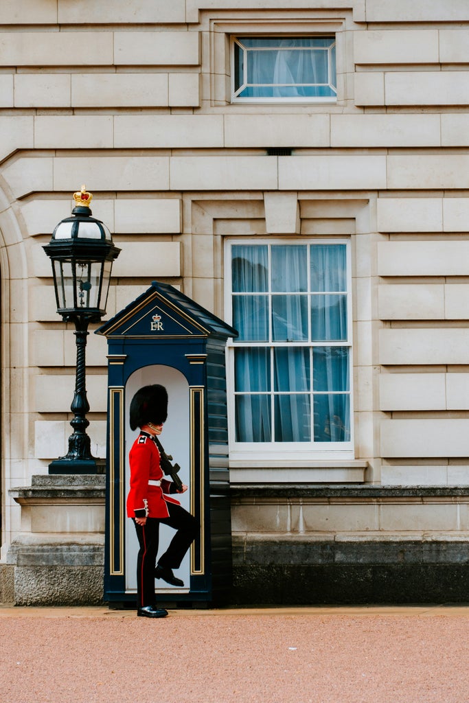 Historic royal landmark walk past ornate Westminster Abbey with elegant stone architecture, regal surroundings, and classic British urban landscape during morning sunlight