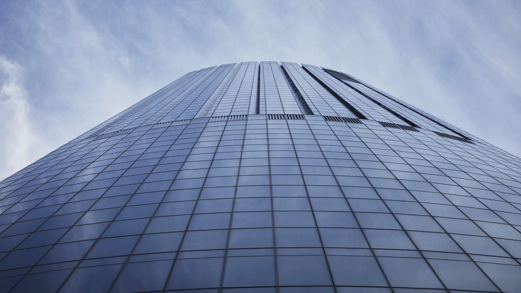 Luxurious glass-and-steel architectural landmark of a modern hotel tower with sleek urban design in downtown Boston skyline