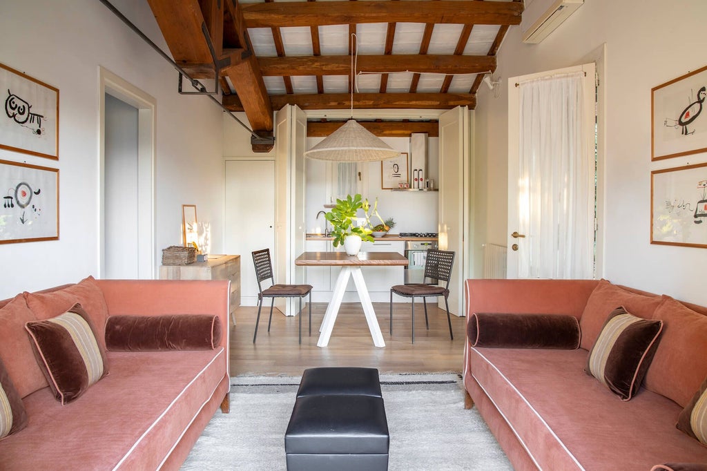 Elegant Italian signature suite with rustic terracotta tones, wooden beamed ceiling, plush white bedding, and soft natural lighting in Tuscany