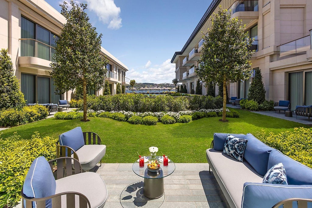 Luxurious Mandarin Bosphorus Room with modern design, floor-to-ceiling windows overlooking Istanbul's scenic waters and elegant, minimalist furnishings