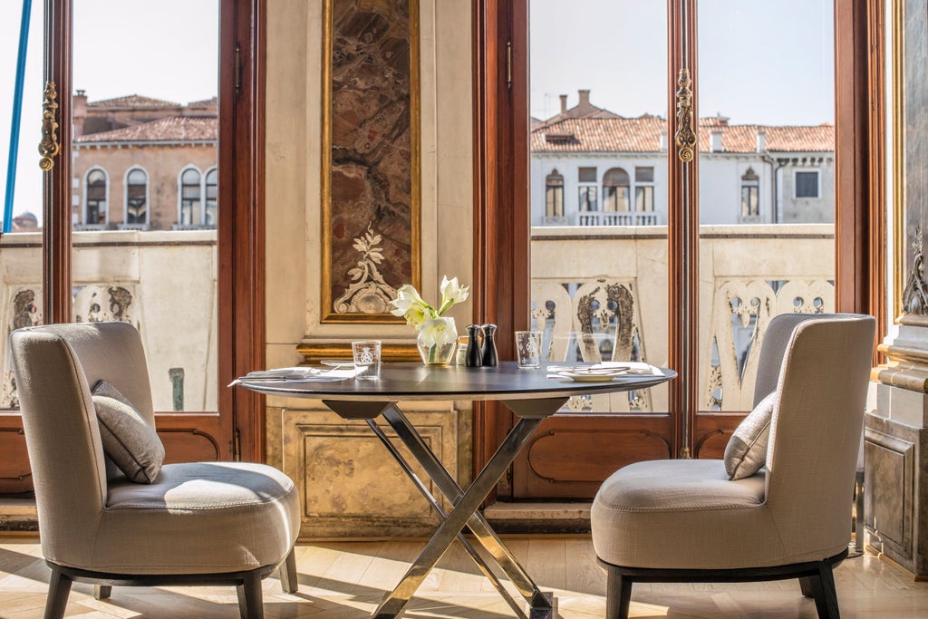 Ornate 16th-century palazzo hotel on Venice's Grand Canal featuring baroque architecture, gilded ceilings and waterfront balconies