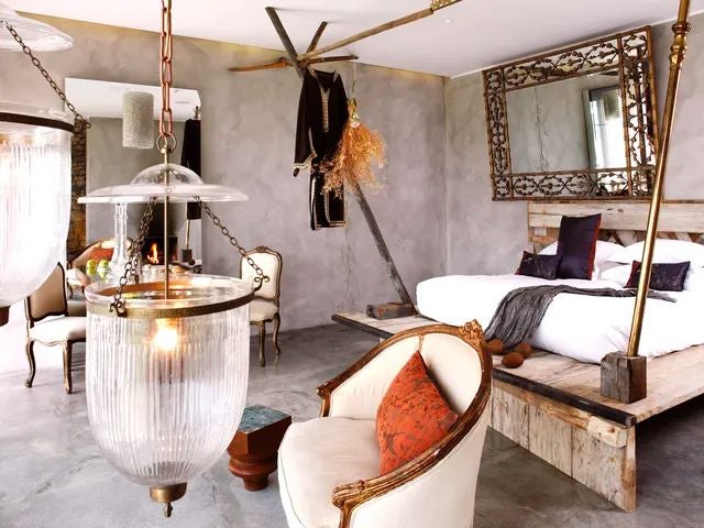 Minimalist beige and white bedroom at Areias do Seixo, featuring ocean-view windows, rustic wooden furniture, and elegant coastal design elements