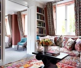 Elegant boutique hotel facade in London's Covent Garden, featuring classic British architecture with modern touches and warm, inviting street-level entrance