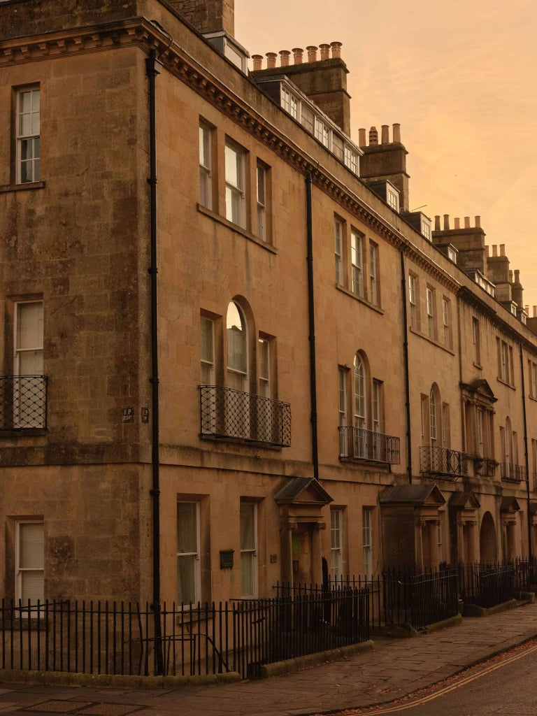 Elegant Georgian townhouse hotel with cream-colored facade, large windows, and classic architectural details in Bath, United Kingdom