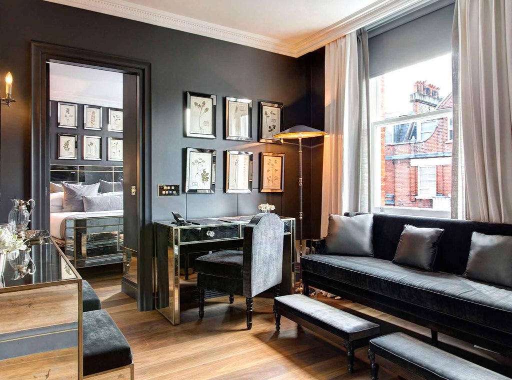 Elegant executive suite with panoramic city views, plush king bed, modern minimalist decor, and floor-to-ceiling windows in The Franklin hotel, United Kingdom