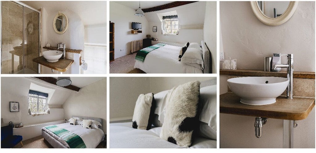 Luxurious rustic bedroom in Weeke Barton, featuring exposed wooden beams, plush white bedding, and elegant countryside charm in United Kingdom.