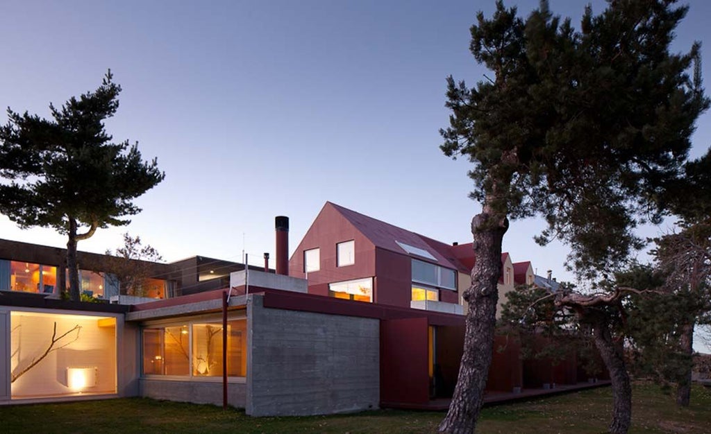 Luxurious mountain retreat nestled in Serra da Estrela, showcasing traditional stone architecture with modern design elements and panoramic alpine landscape views