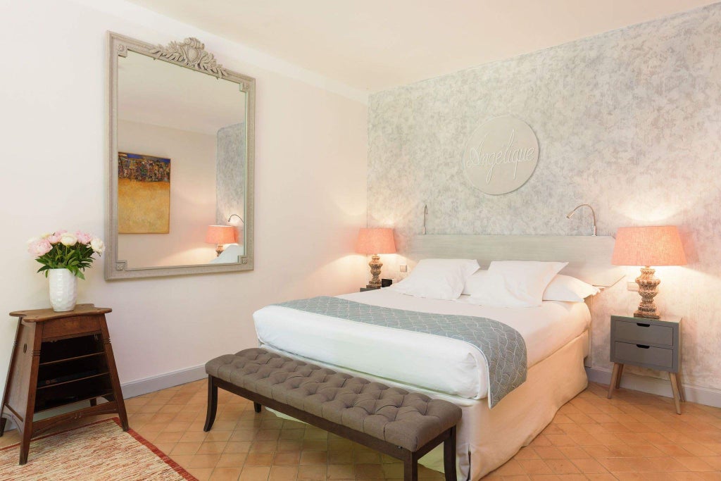 Elegant French countryside hotel room with soft beige linens, antique wooden furniture, and sunlight streaming through delicate lace curtains