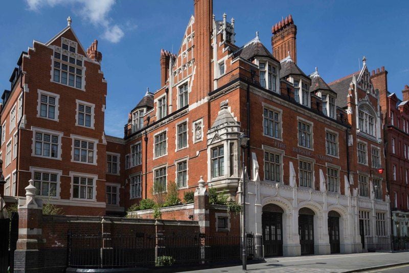 Luxurious exterior of Chiltern Firehouse, a restored historic red-brick building with elegant facade in central London's upscale Marylebone neighborhood