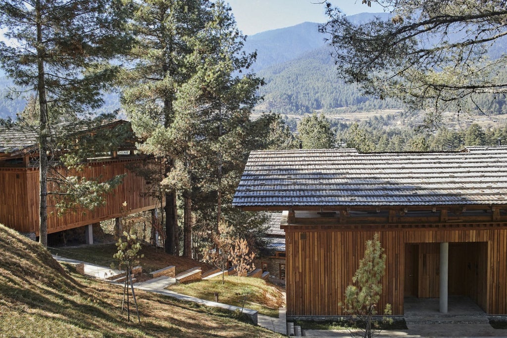 Luxurious wooden lodge with floor-to-ceiling windows nestled among pine forests in Bhutan, featuring minimalist architecture and natural materials