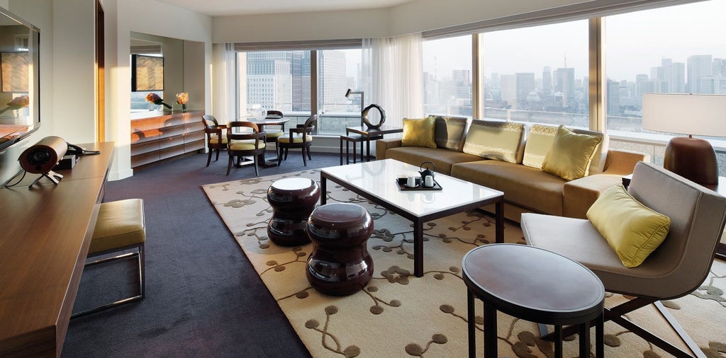 Elegant park-view suite at luxury Tokyo hotel, featuring minimalist design, floor-to-ceiling windows, and sophisticated neutral color palette with city skyline backdrop