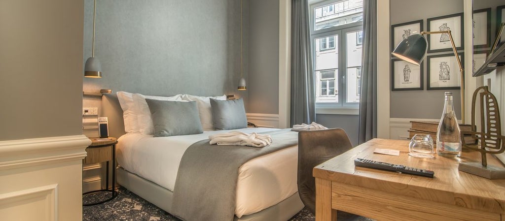 Elegant Hotel da Baixa classic room with pristine white bedding, large windows, soft neutral tones, and a picturesque city view of Porto's historic district