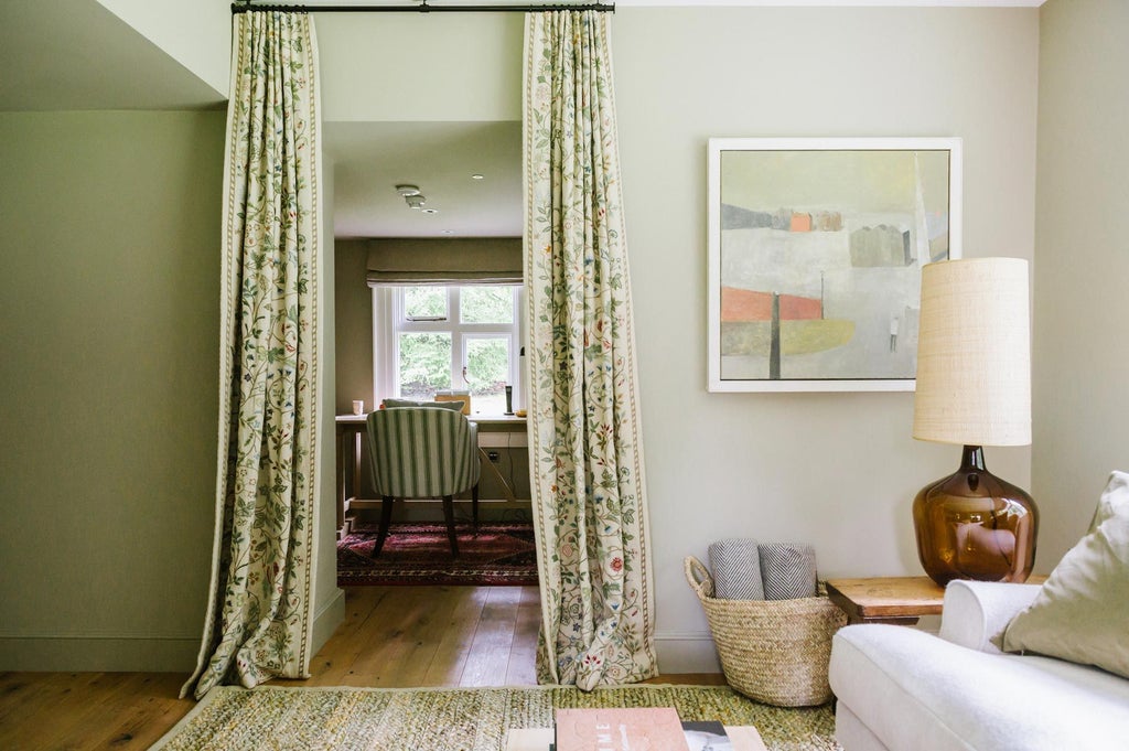 Elegant church-converted lodge room at Scenset hotel, featuring rustic wooden floors, modern minimalist furnishings, and soft natural lighting through arched windows