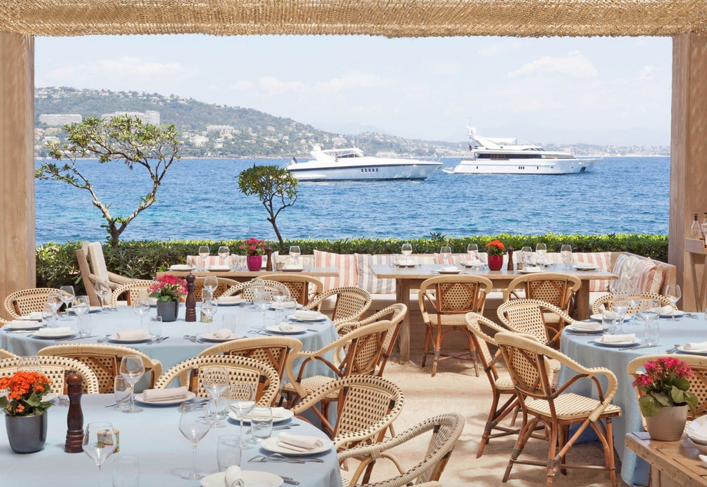 Luxury yacht cruising azure French Riviera waters, sun-drenched Mediterranean coastline with chic passengers enjoying a glamorous day near Monaco