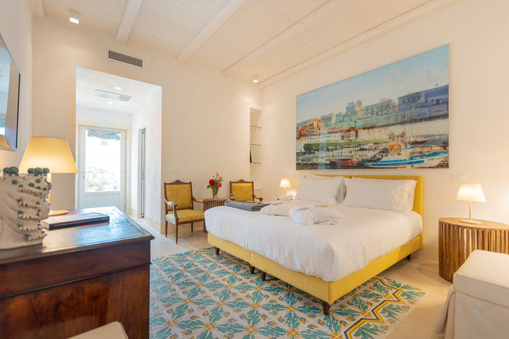 Elegant Sicilian hotel room with soft neutral tones, ornate antique furnishings, white linens, and traditional architectural details in warm daylight